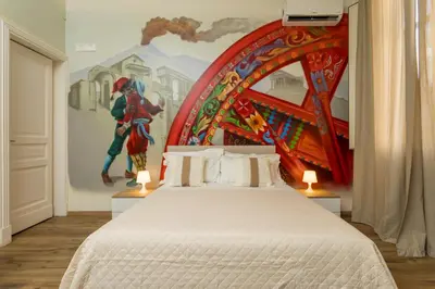 Letto o letti in una camera di Catania Urban Rooms - Artistic Design Rooms in Catania Center near Via Etnea