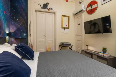 Letto o letti in una camera di Catania Urban Rooms - Artistic Design Rooms in Catania Center near Via Etnea