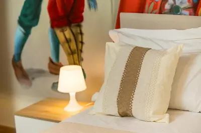 Letto o letti in una camera di Catania Urban Rooms - Artistic Design Rooms in Catania Center near Via Etnea