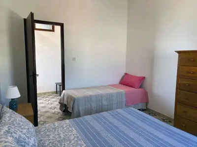 Letto o letti in una camera di Terrazza delle Acacie