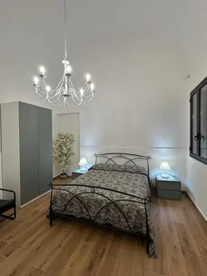 Letto o letti in una camera di Bentihome