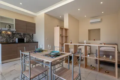 Cucina o angolo cottura di GuestHost - Isole Ciclopi View - Lovely Apartment