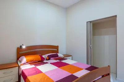 Letto o letti in una camera di GuestHost - Isole Ciclopi View - Lovely Apartment