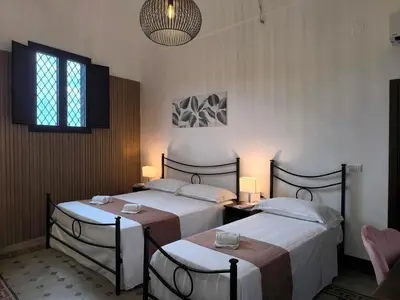 Letto o letti in una camera di Agriturismo Travaglianti Alloggio Etna