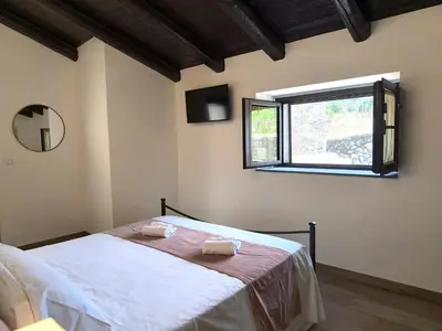 Letto o letti in una camera di Agriturismo Travaglianti Alloggio Etna