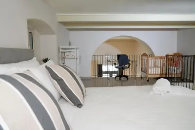 Letto o letti in una camera di RHOME Crispi LOFT