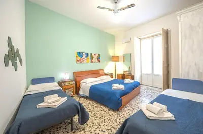 Letto o letti in una camera di Eleganti Camere in Centro a due passi dalla Stazione