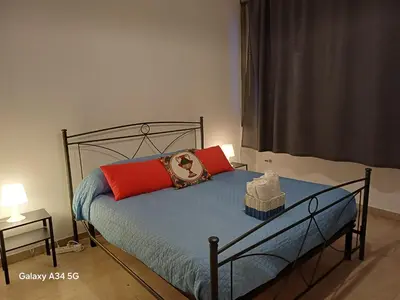 Letto o letti in una camera di Domus Viatoris Catania Centro