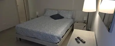 Letto o letti in una camera di Short Location Paratore Casa Melina