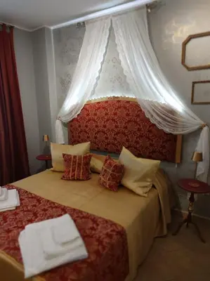 Letto o letti in una camera di Dimora del Doge