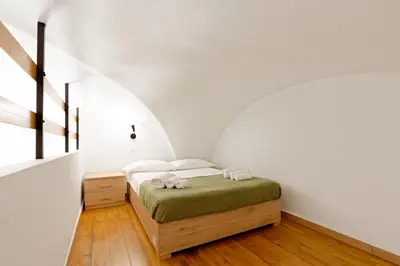 Letto o letti in una camera di Hermann Apartments