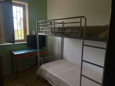 Letto o letti a castello in una camera di Maison Rosita