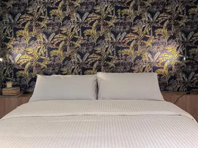 Letto o letti in una camera di Juliet Suites I