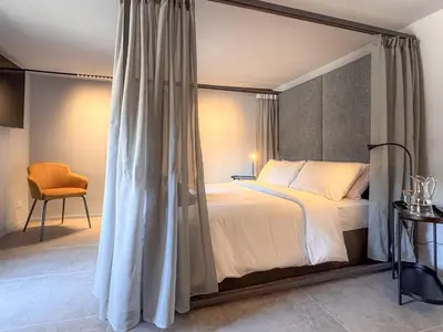 Letto o letti in una camera di Juliet Suites II