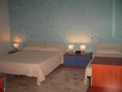 Letto o letti in una camera di Etna Inn