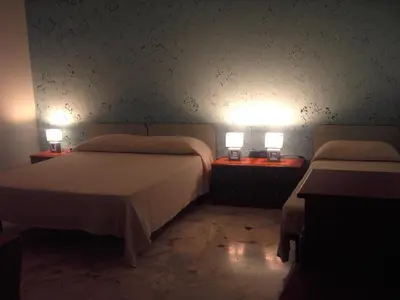 Letto o letti in una camera di Etna Inn