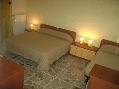 Letto o letti in una camera di Etna Inn