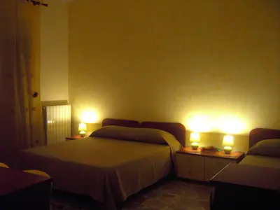 Letto o letti in una camera di Etna Inn
