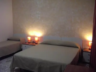 Letto o letti in una camera di Etna Inn