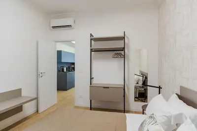 Letto o letti in una camera di RuBia Homes by Letstay
