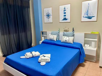 Letto o letti in una camera di Punta Aguzza