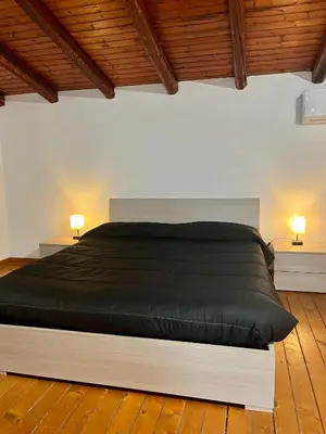 Letto o letti in una camera di Li Cuti Apartments 179