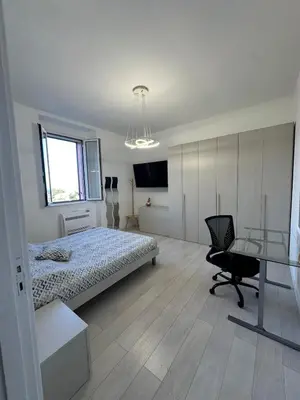 Letto o letti in una camera di Lumi Home - ApartHotel Bentivoglio