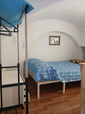 Letto o letti in una camera di Tri-na-krì-a