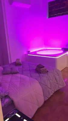 Letto o letti in una camera di Oasi Love