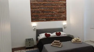 Letto o letti in una camera di Oasi Love