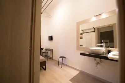 Letto o letti in una camera di Romano Rooms