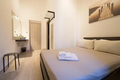 Letto o letti in una camera di Romano Rooms