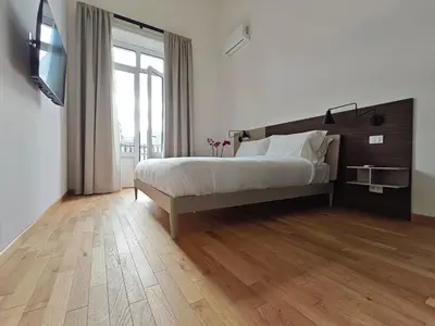Letto o letti in una camera di Tambasia rooms, Centro storico,Via Etnea