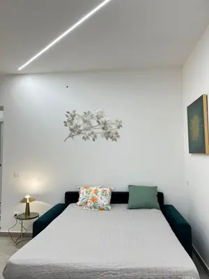 Letto o letti in una camera di Mongibello Apartment