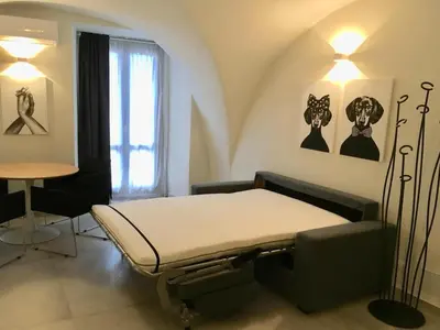 Letto o letti in una camera di Modern and historic openspace in the center