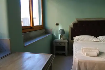 Letto o letti in una camera di Cavour Rooms