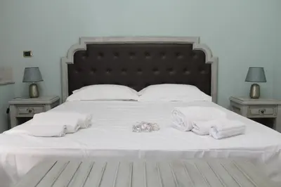 Letto o letti in una camera di Cavour Rooms
