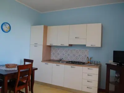 Cucina o angolo cottura di Apartment Zweizimmerwohnung 1 mit Terrasse- Gemeinschaftspool by Interhome