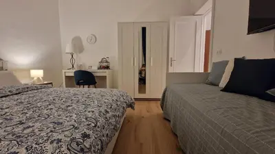 Letto o letti in una camera di Aosta apartment, to always feel at home