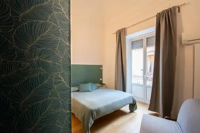 Letto o letti in una camera di Catania City Rooms