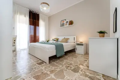 Letto o letti in una camera di appartamento condorelli