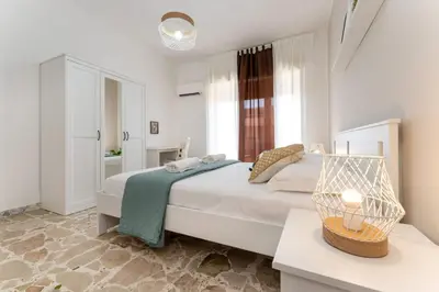 Letto o letti in una camera di appartamento condorelli