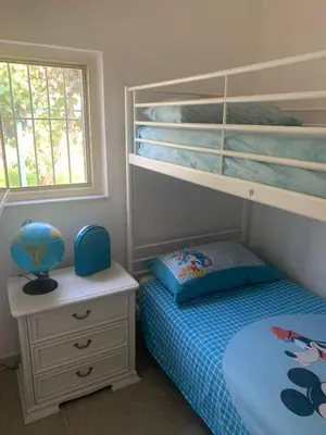 Letto o letti in una camera di Casa dei Gigli relax and vacation among flowers and fruits