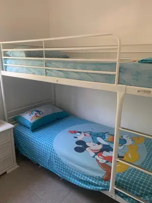 Letto o letti in una camera di Casa dei Gigli relax and vacation among flowers and fruits