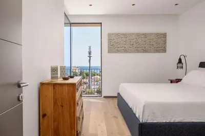 Letto o letti in una camera di Top-Floor Sea View with Pool Access