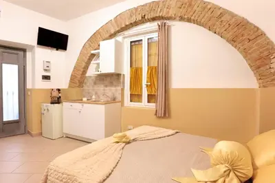Letto o letti in una camera di U Casteddu Home Motta Sant'Anastasia 2