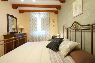 Letto o letti in una camera di Villino AL CASTAGNO