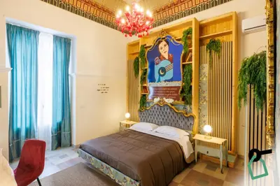 Letto o letti in una camera di Hotiday Catania Stanze Letterarie