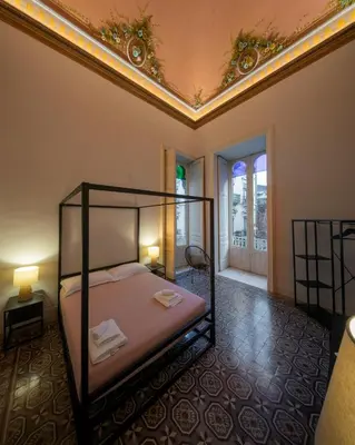 Letto o letti in una camera di Palazzo Mazzone