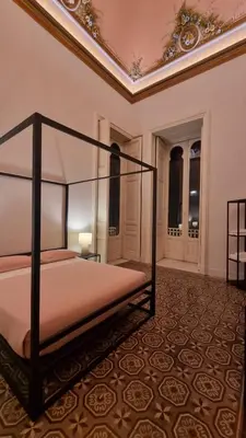 Letto o letti in una camera di Palazzo Mazzone